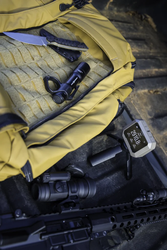 Tactical outdoor gear including range bags, GPS units, and ballistic helmets from Kenzie’s Optics