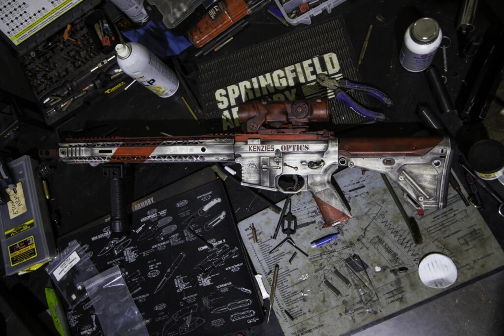 Custom Kenzie’s Optics AR-15 rifle on display with optic and accessories