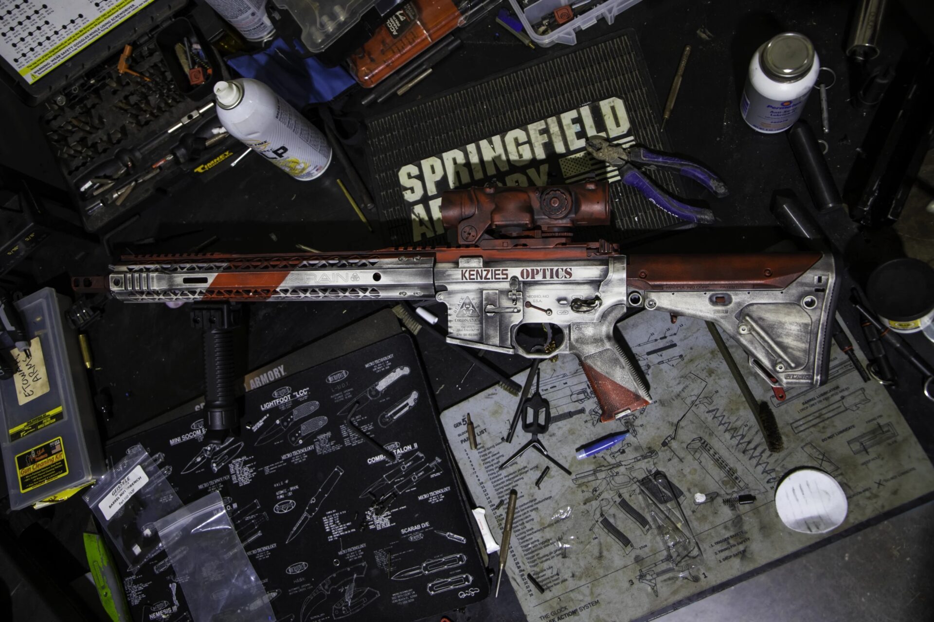 Custom Kenzie’s Optics AR-15 rifle on display with optic and accessories