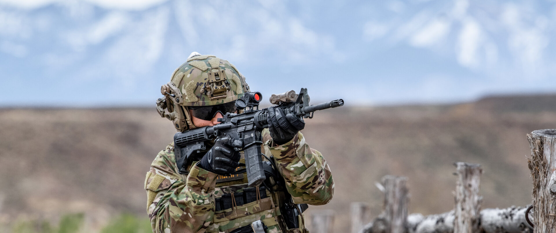 Rifle-mounted red dot optics on AR platforms from Aimpoint and Holosun